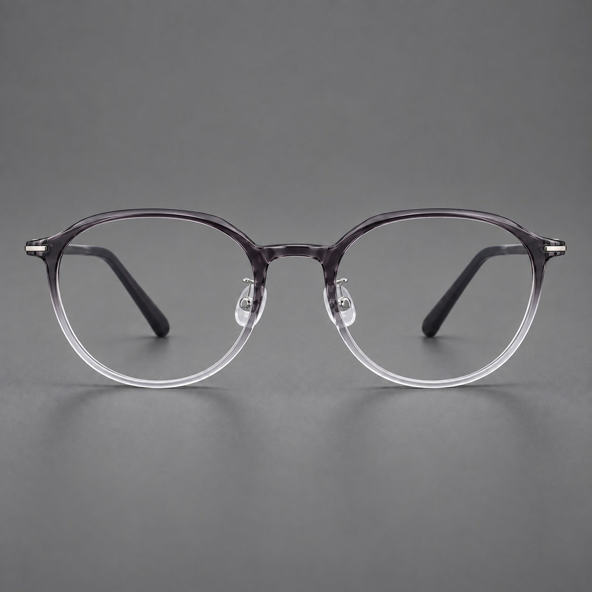 Retro round plastic eyeglasses with a curved bridge and slim metal corner accents — Ink Grey Gradient — Front view [CINILY-JD2026-2201-C2]