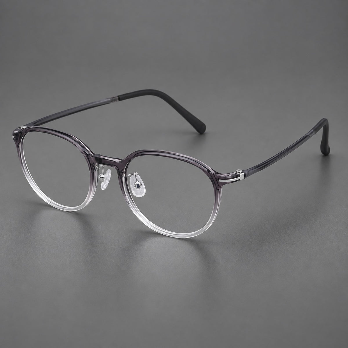 Retro round plastic eyeglasses with a curved bridge and slim metal corner accents — Ink Grey Gradient — Main view [CINILY-JD2026-2201-C2]