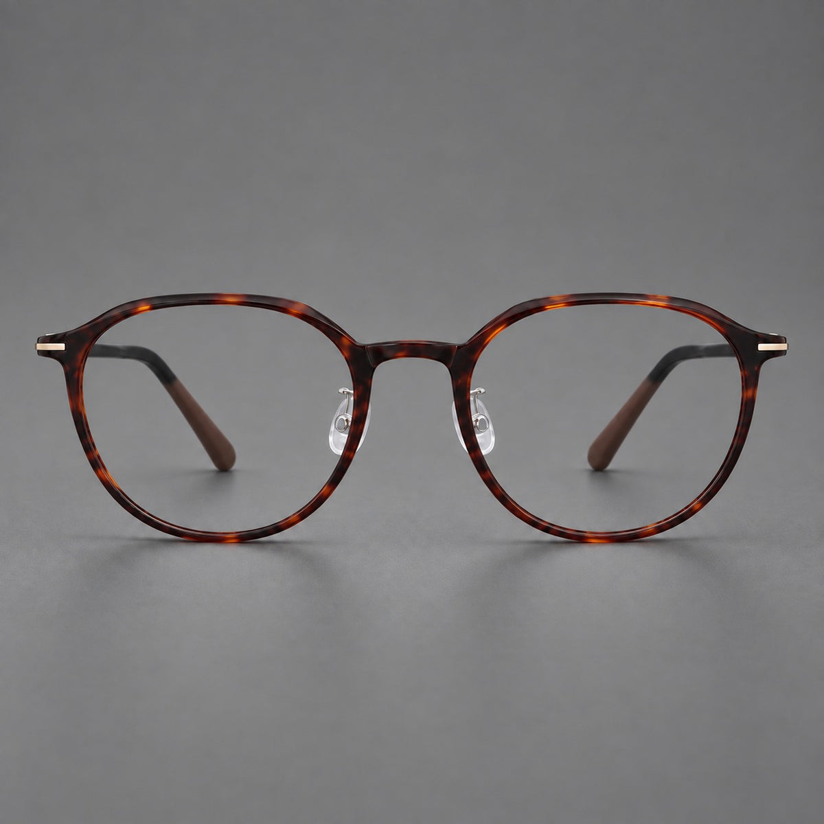Retro round plastic eyeglasses with a curved bridge and slim metal corner accents — Tortoiseshell — Front view [CINILY-JD2026-2201-C20]