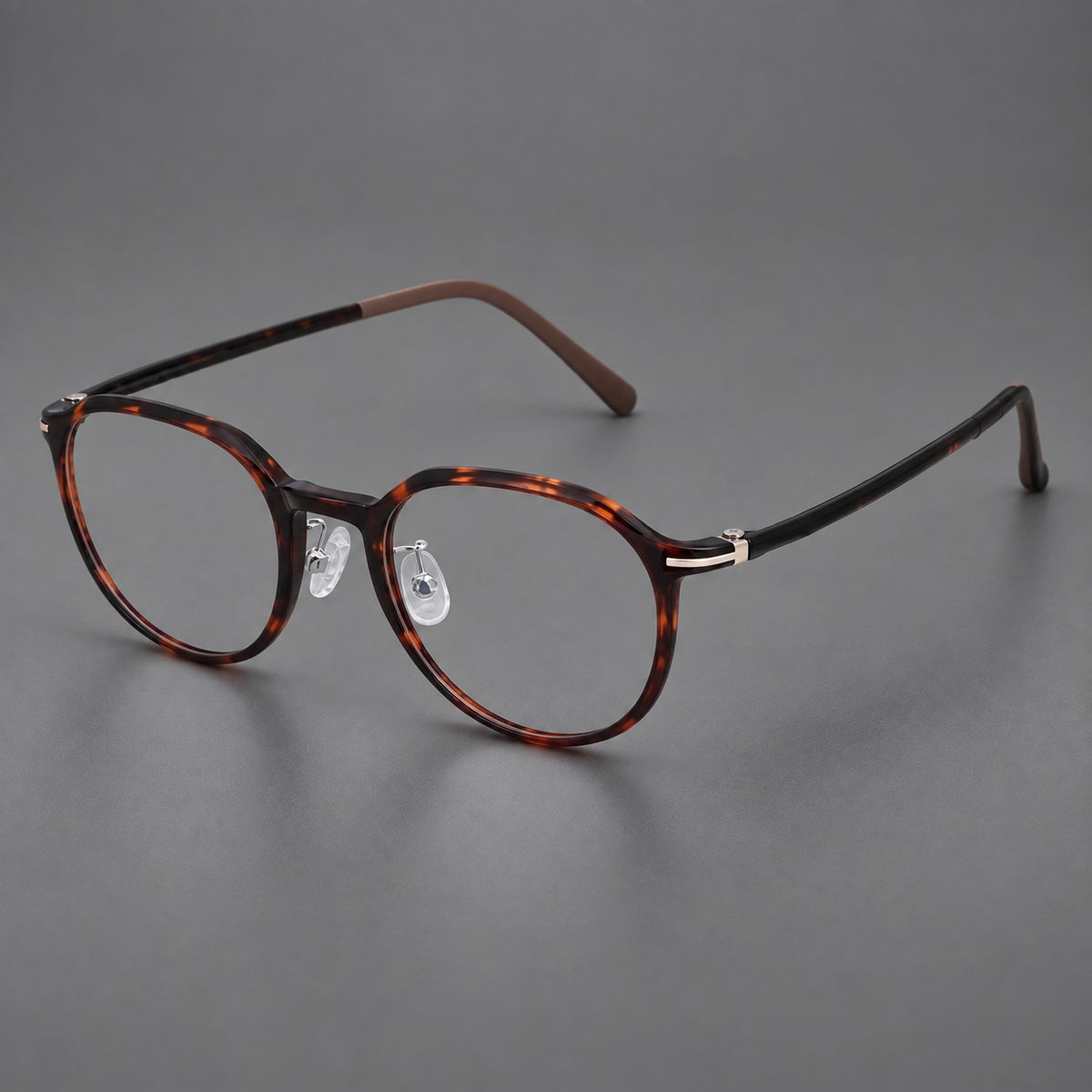 Retro round plastic eyeglasses with a curved bridge and slim metal corner accents — Tortoiseshell — Main view [CINILY-JD2026-2201-C20]