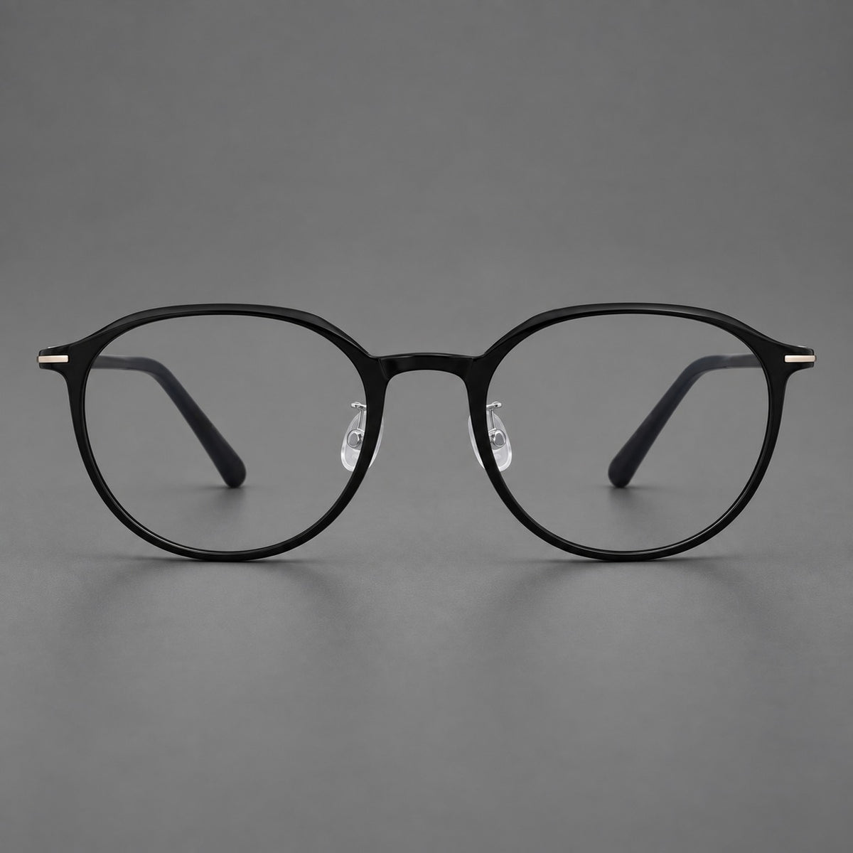 Retro round plastic eyeglasses with a curved bridge and slim metal corner accents — Glossy Black — Front view [CINILY-JD2026-2201-C6]