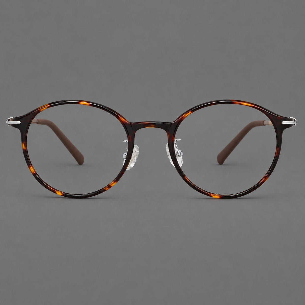 Compact round plastic eyeglasses with gently lifted corners and clear nose pads — Tortoiseshell — Front view [CINILY-JD2026-2202-C20]