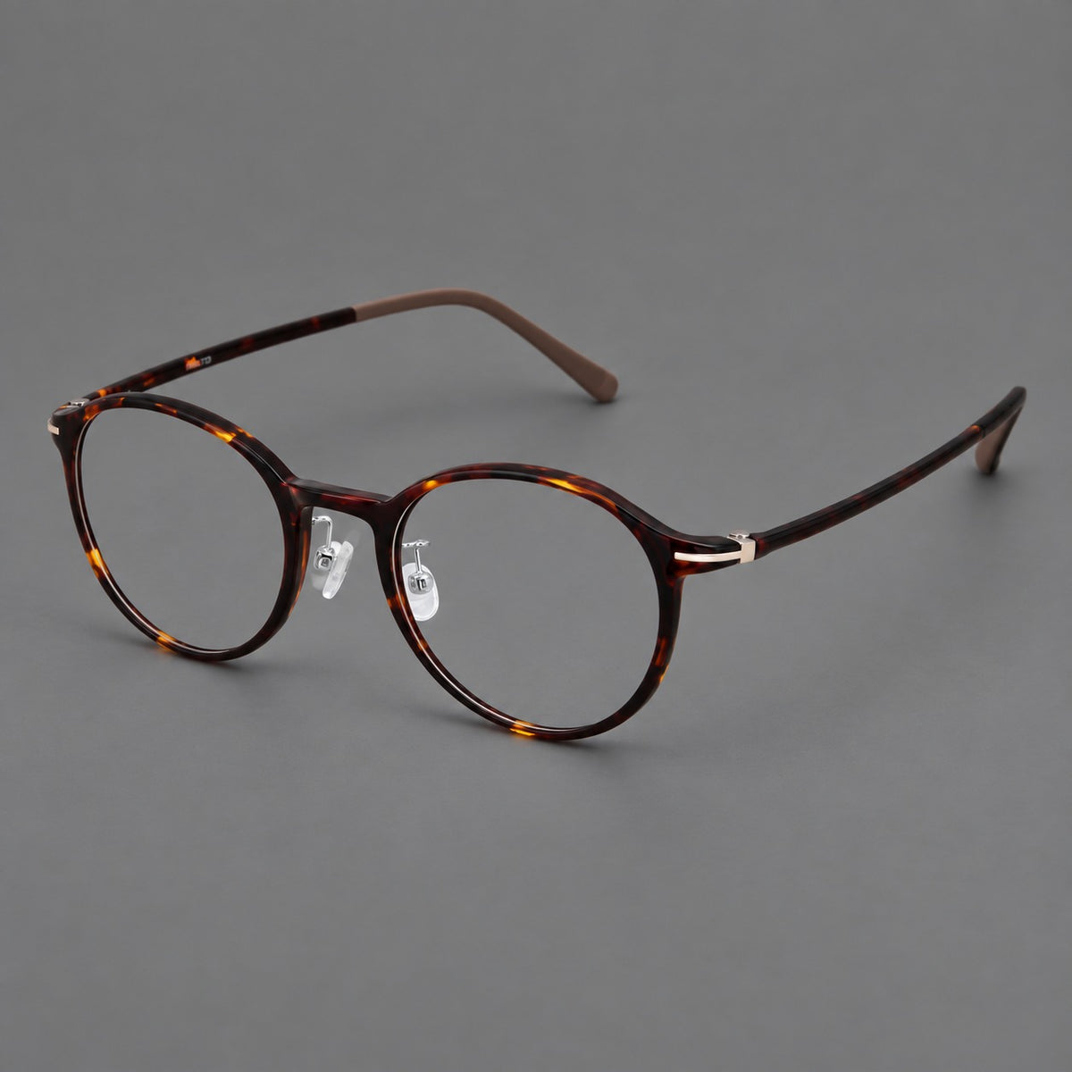 Compact round plastic eyeglasses with gently lifted corners and clear nose pads — Tortoiseshell — Main view [CINILY-JD2026-2202-C20]
