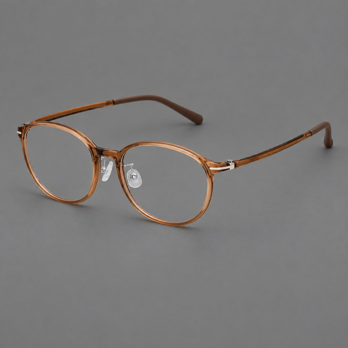 Slim oval plastic eyeglasses with a low profile and subtle metal corner accents — Honey Tea — Main view [CINILY-JD2026-2204-C14]