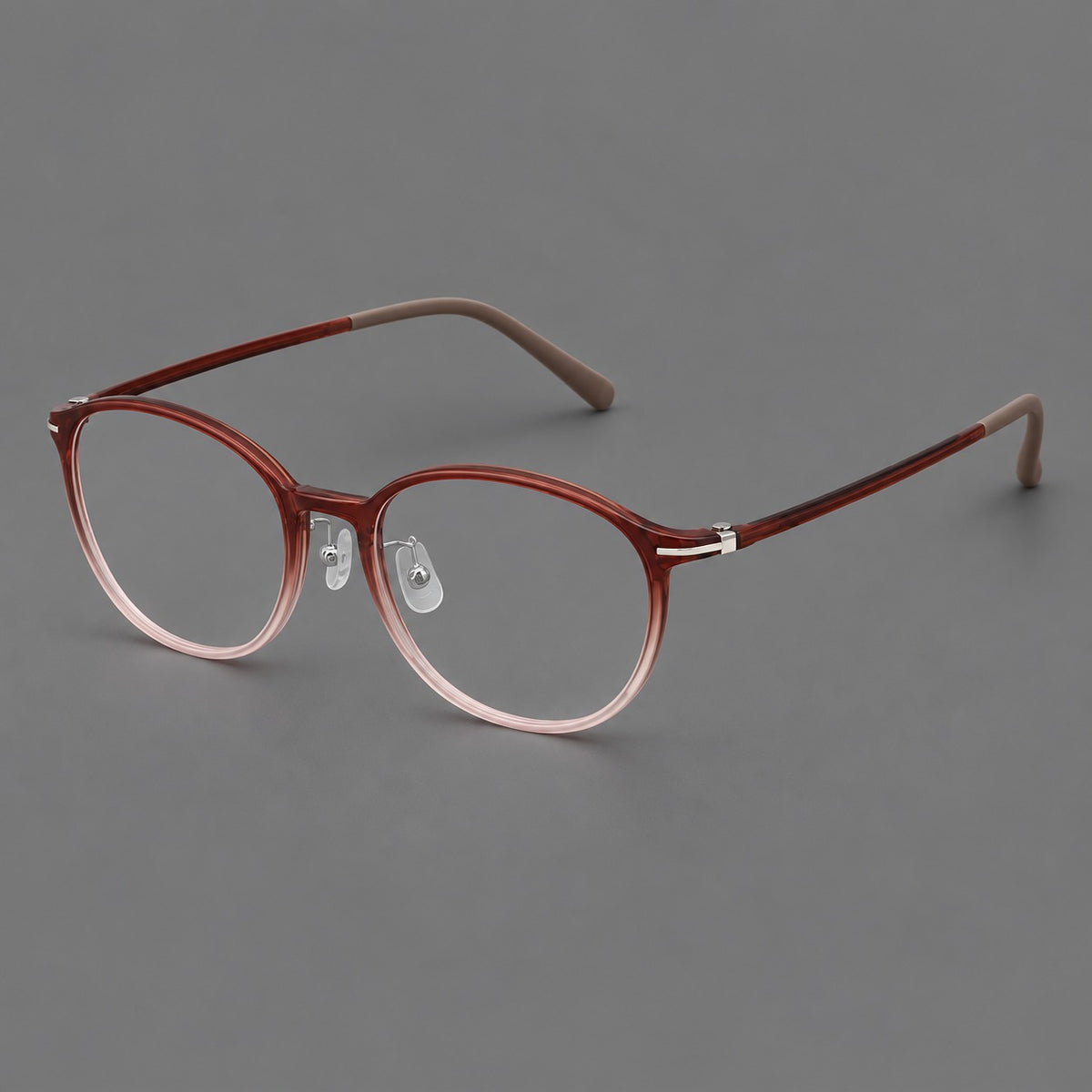 Slim oval plastic eyeglasses with a low profile and subtle metal corner accents — Red Brown Gradient — Main view [CINILY-JD2026-2204-C7]