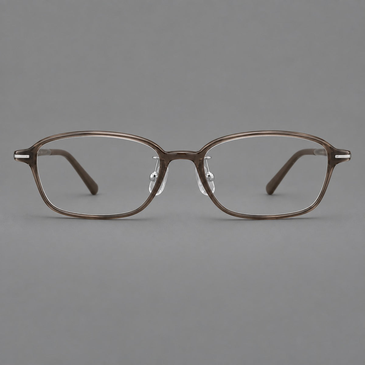 Soft oval plastic eyeglasses with a narrow bridge and gently rounded outer corners — Ink Brown — Front view [CINILY-JD2026-2211-C7]
