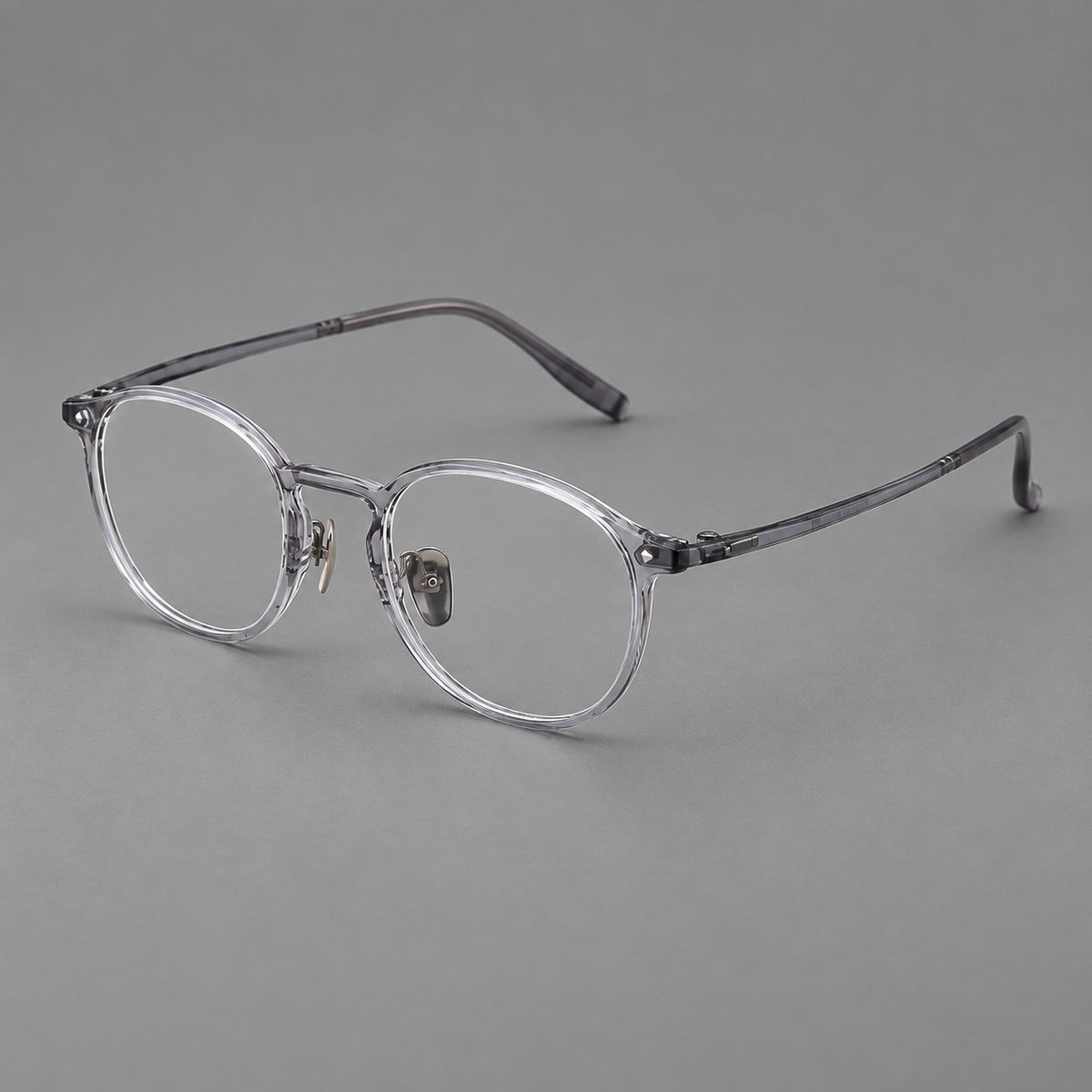 Vintage round plastic eyeglasses with a curved bridge and subtle triangular accents — Light Grey — Main view [CINILY-JD2026-2218-C1]