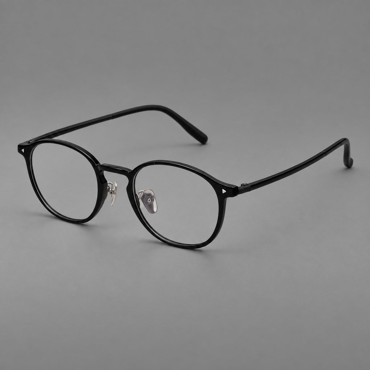 Vintage round plastic eyeglasses with a curved bridge and subtle triangular accents — Glossy Black — Main view [CINILY-JD2026-2218-C6]