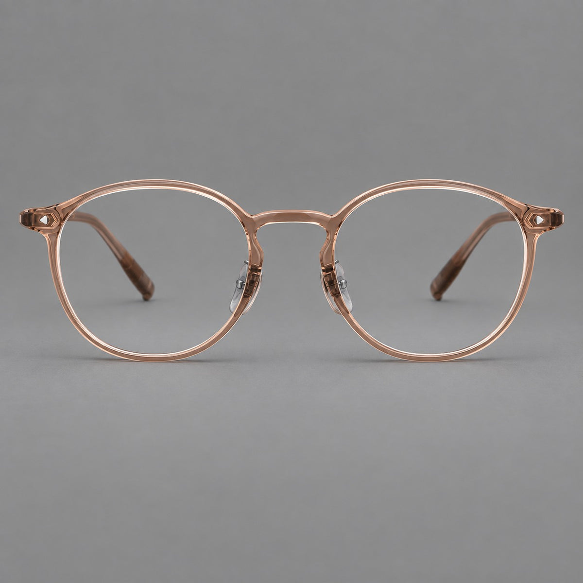 Vintage round plastic eyeglasses with a curved bridge and subtle triangular accents — Tea — Front view [CINILY-JD2026-2218-C7]