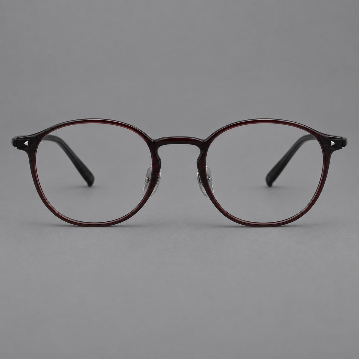 Vintage round plastic eyeglasses with a curved bridge and subtle triangular accents — Deep Wine Red — Front view [CINILY-JD2026-2218-C9]