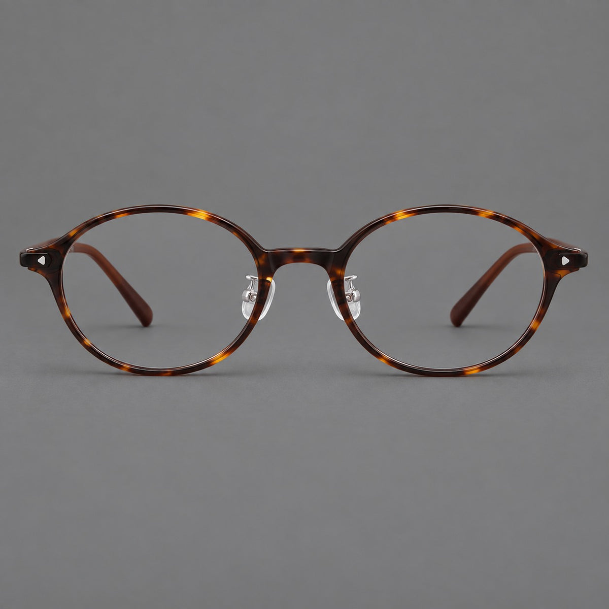 Retro round plastic eyeglasses with softly lifted corners and a sculpted bridge — Tortoiseshell — Front view [CINILY-JD2026-2221-C20]