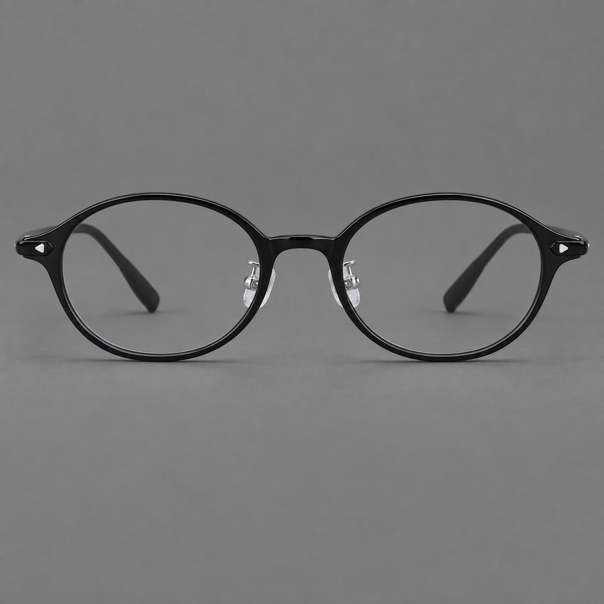 Retro round plastic eyeglasses with softly lifted corners and a sculpted bridge — Glossy Black — Front view [CINILY-JD2026-2221-C6]