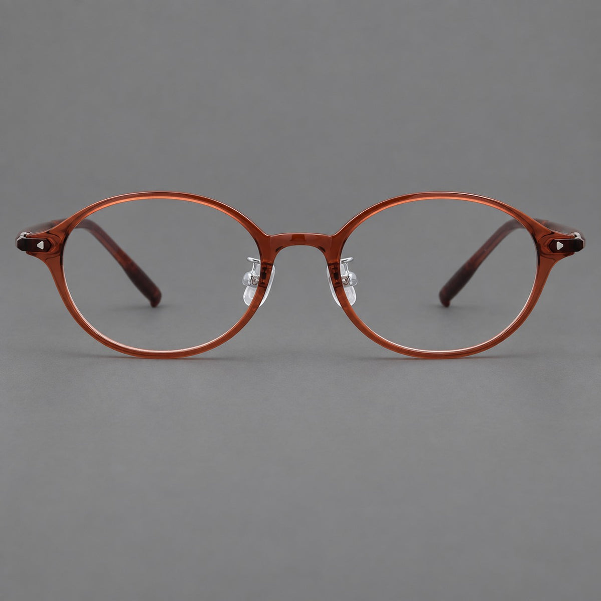 Retro round plastic eyeglasses with softly lifted corners and a sculpted bridge — Brown Red — Front view [CINILY-JD2026-2221-C9]