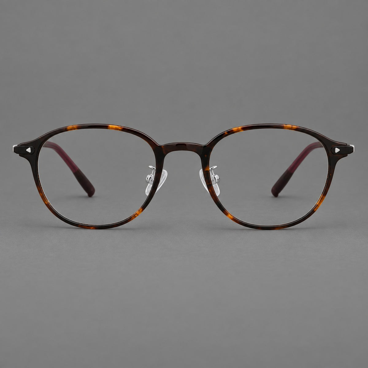 Panto plastic eyeglasses with a rounded silhouette and triangular corner studs — Tortoiseshell — Front view [CINILY-JD2026-2222-C20]
