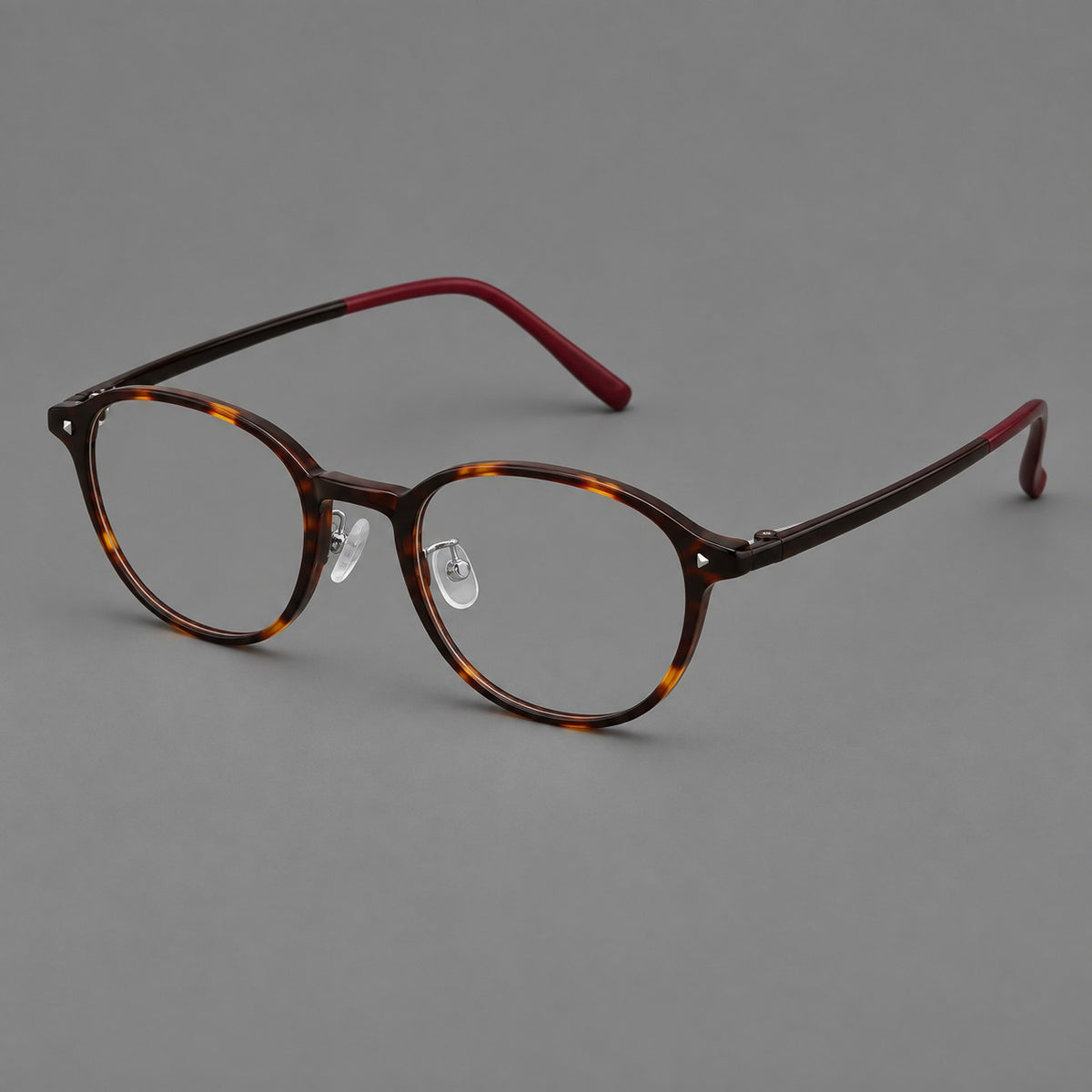 Panto plastic eyeglasses with a rounded silhouette and triangular corner studs — Tortoiseshell — Main view [CINILY-JD2026-2222-C20]