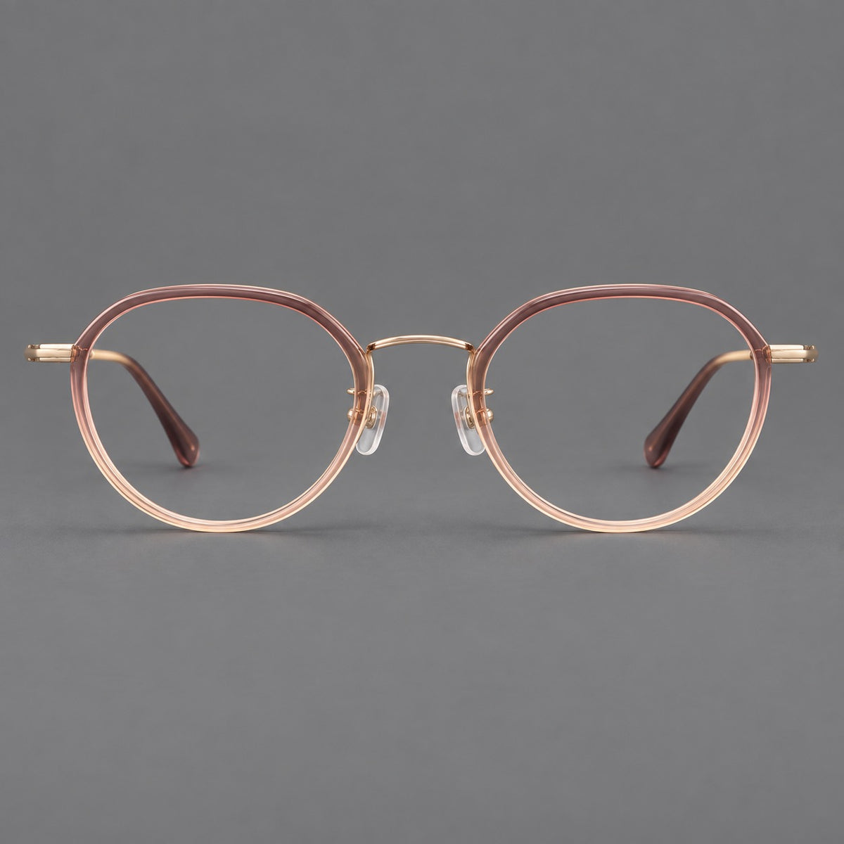 Rounded eyeglasses in acetate and titanium with gently arched brows and engraved metal temples — Pink Tea Gradient / Rose Gold — Front view [CINILY-JD2026-61002-C3]