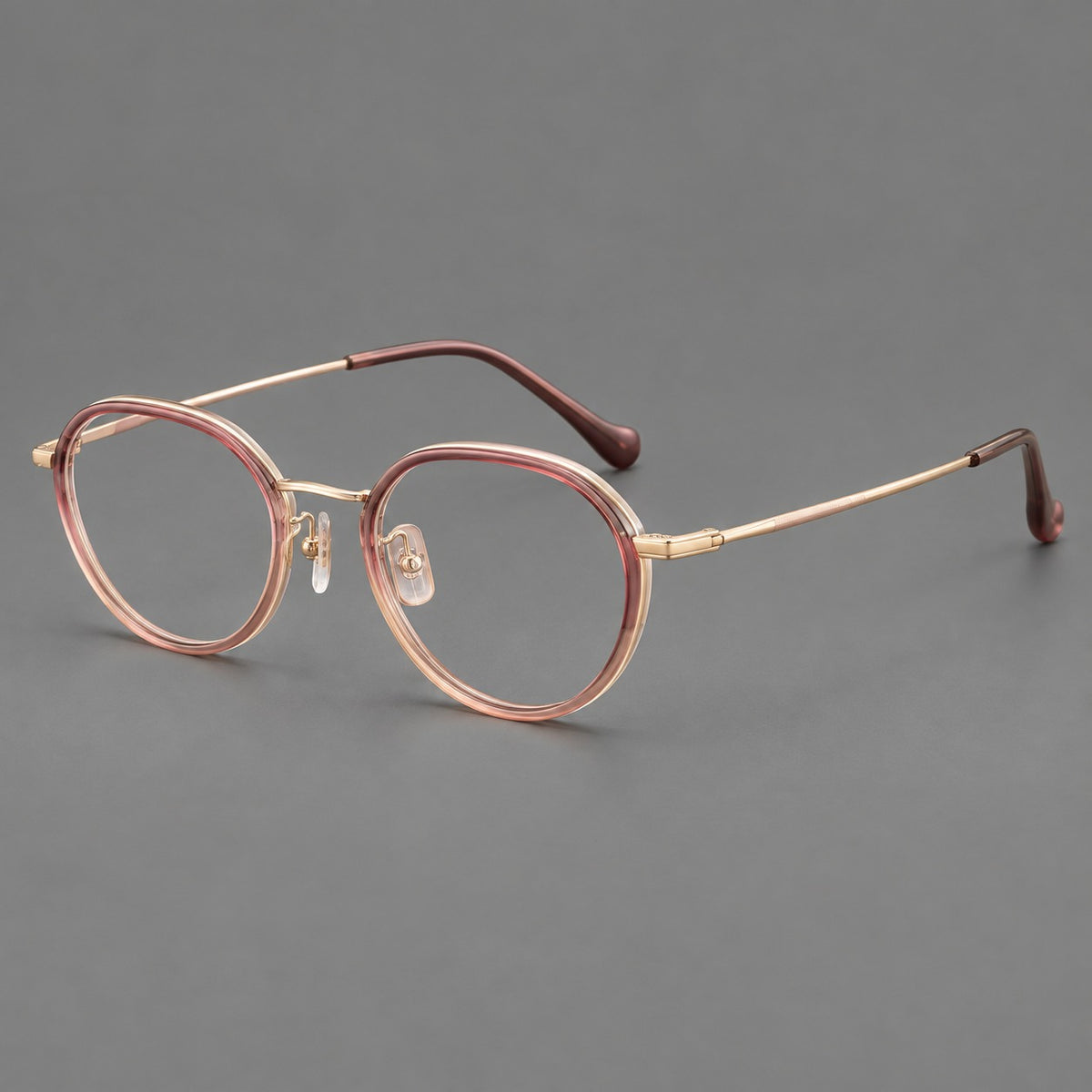 Rounded eyeglasses in acetate and titanium with gently arched brows and engraved metal temples — Pink Tea Gradient / Rose Gold — Main view [CINILY-JD2026-61002-C3]