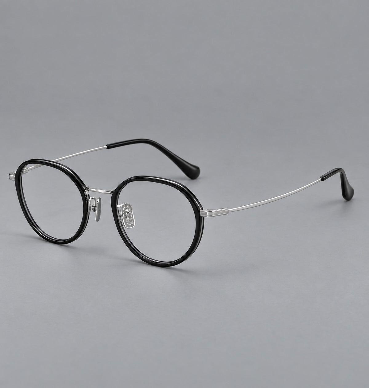 Rounded eyeglasses in acetate and titanium with gently arched brows and engraved metal temples — Black / Silver — Main view [CINILY-JD2026-61002-C5]