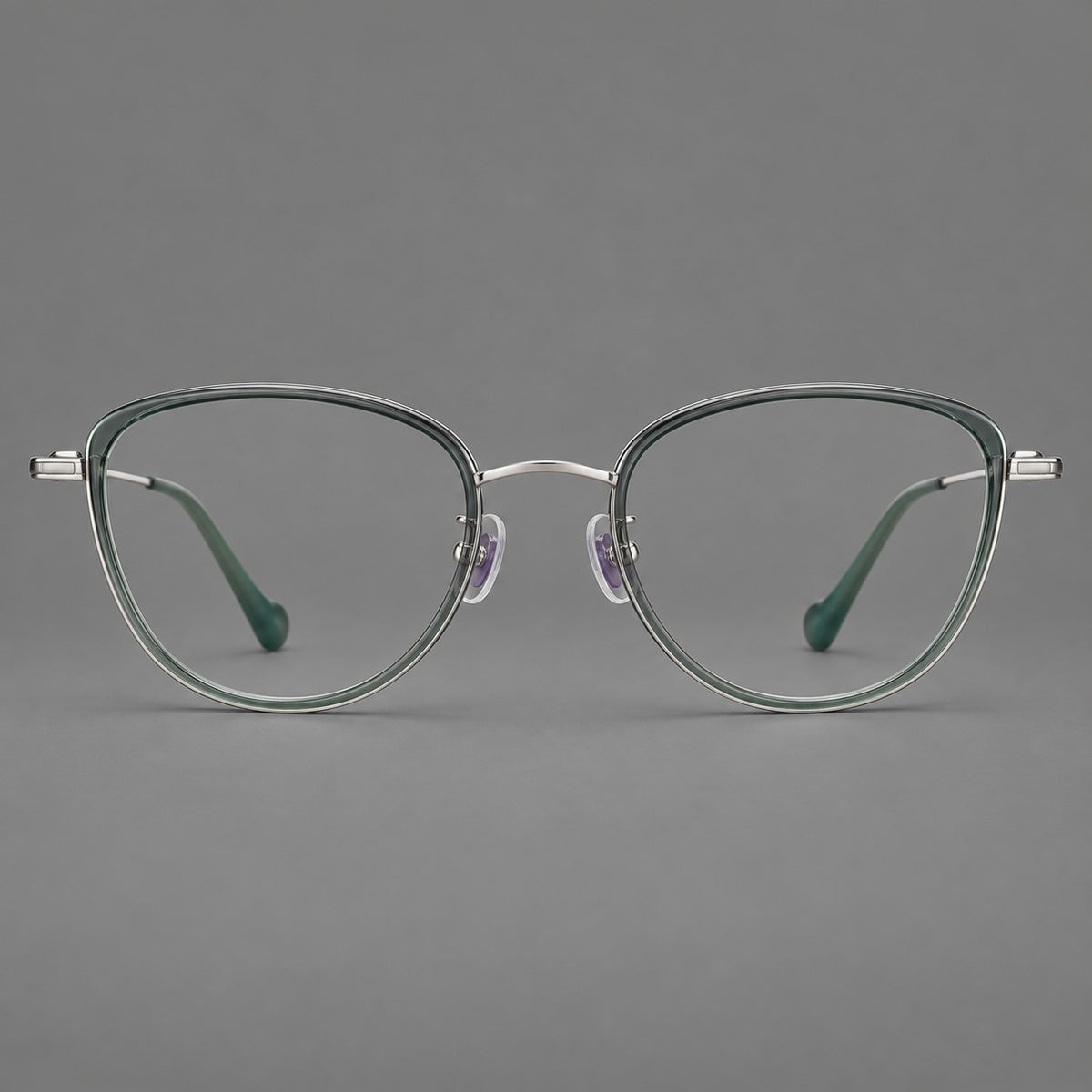Upswept eyeglasses in acetate and titanium with softly rounded rims and tapered metal temples — Clear Green / Silver — Front view [CINILY-JD2026-61003-C1]