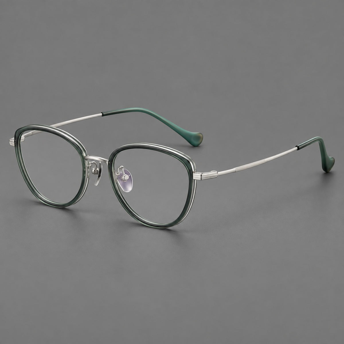 Upswept eyeglasses in acetate and titanium with softly rounded rims and tapered metal temples — Clear Green / Silver — Main view [CINILY-JD2026-61003-C1]