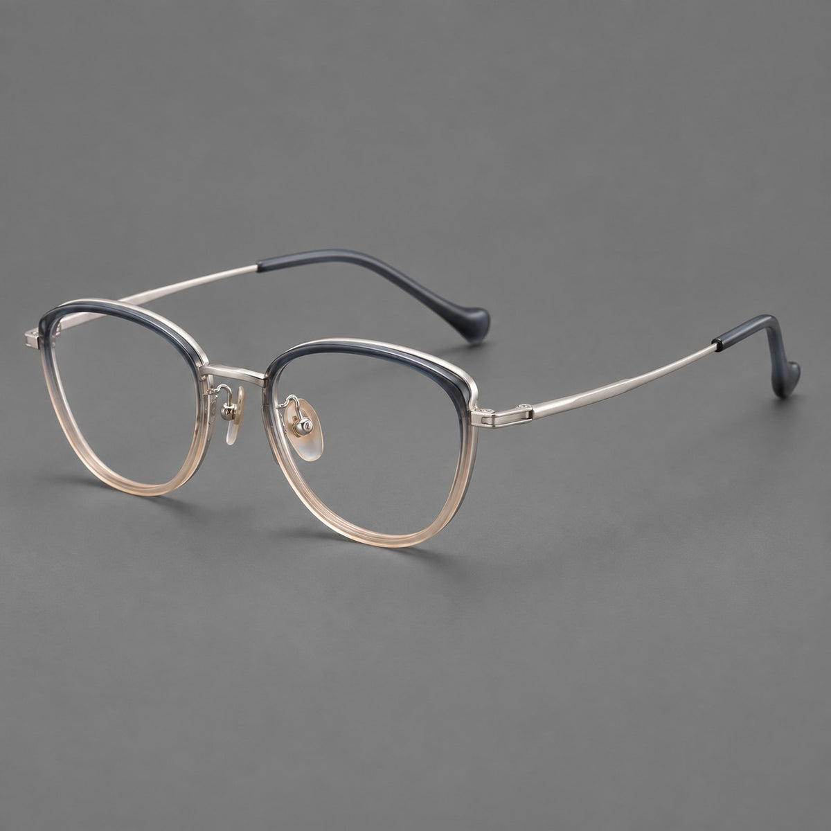 Upswept eyeglasses in acetate and titanium with softly rounded rims and tapered metal temples — Blue Tea Gradient / Gunmetal — Main view [CINILY-JD2026-61003-C3]