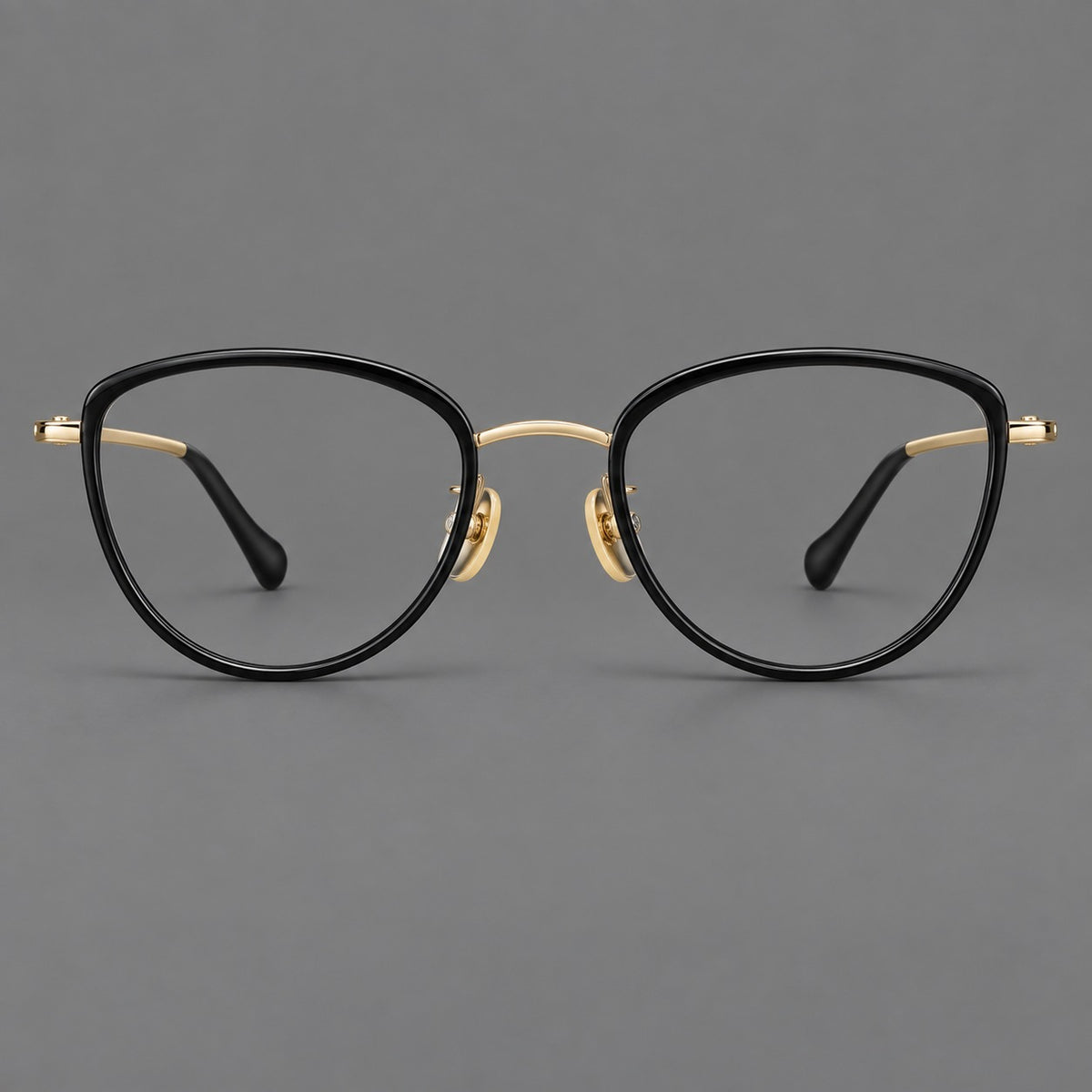 Upswept eyeglasses in acetate and titanium with softly rounded rims and tapered metal temples — Black / Gold — Front view [CINILY-JD2026-61003-C5]