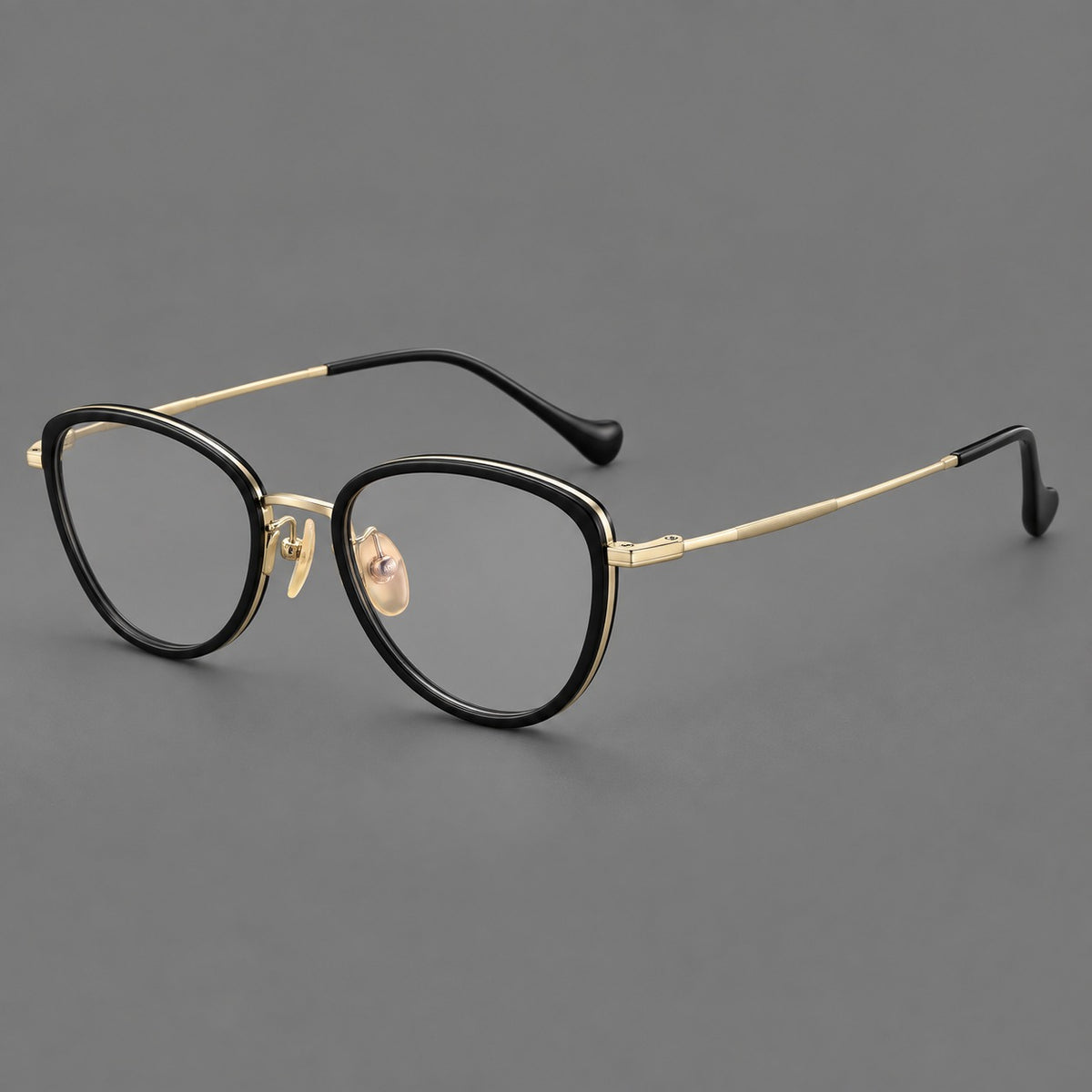 Upswept eyeglasses in acetate and titanium with softly rounded rims and tapered metal temples — Black / Gold — Main view [CINILY-JD2026-61003-C5]
