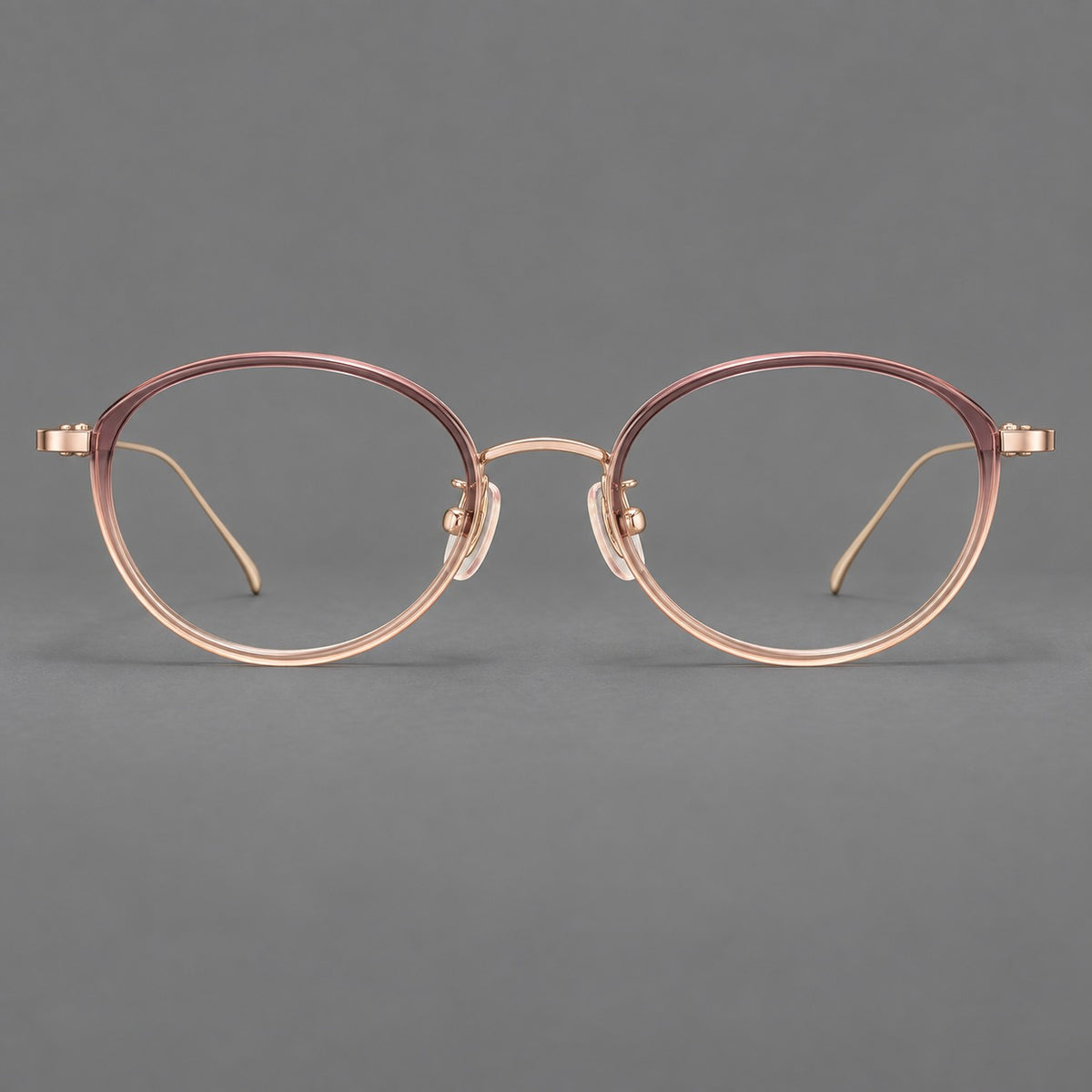 Round eyeglasses in acetate and titanium with a slim curved bridge and fine metal temples — Pink Tea Gradient / Rose Gold — Front view [CINILY-JD2026-61004-C2]