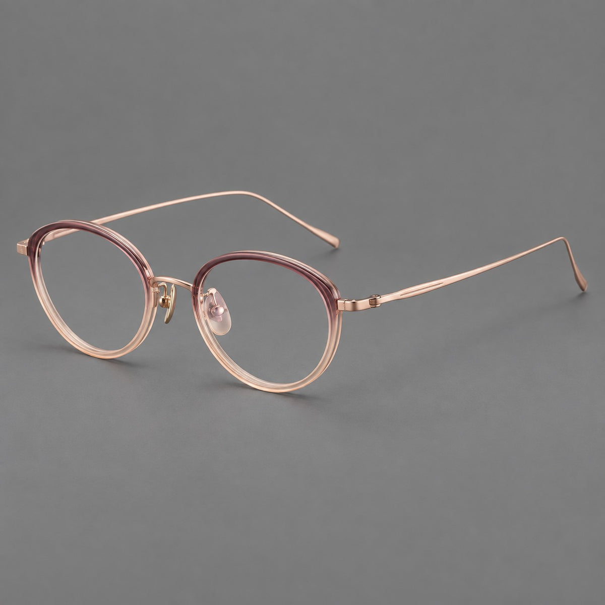 Round eyeglasses in acetate and titanium with a slim curved bridge and fine metal temples — Pink Tea Gradient / Rose Gold — Main view [CINILY-JD2026-61004-C2]