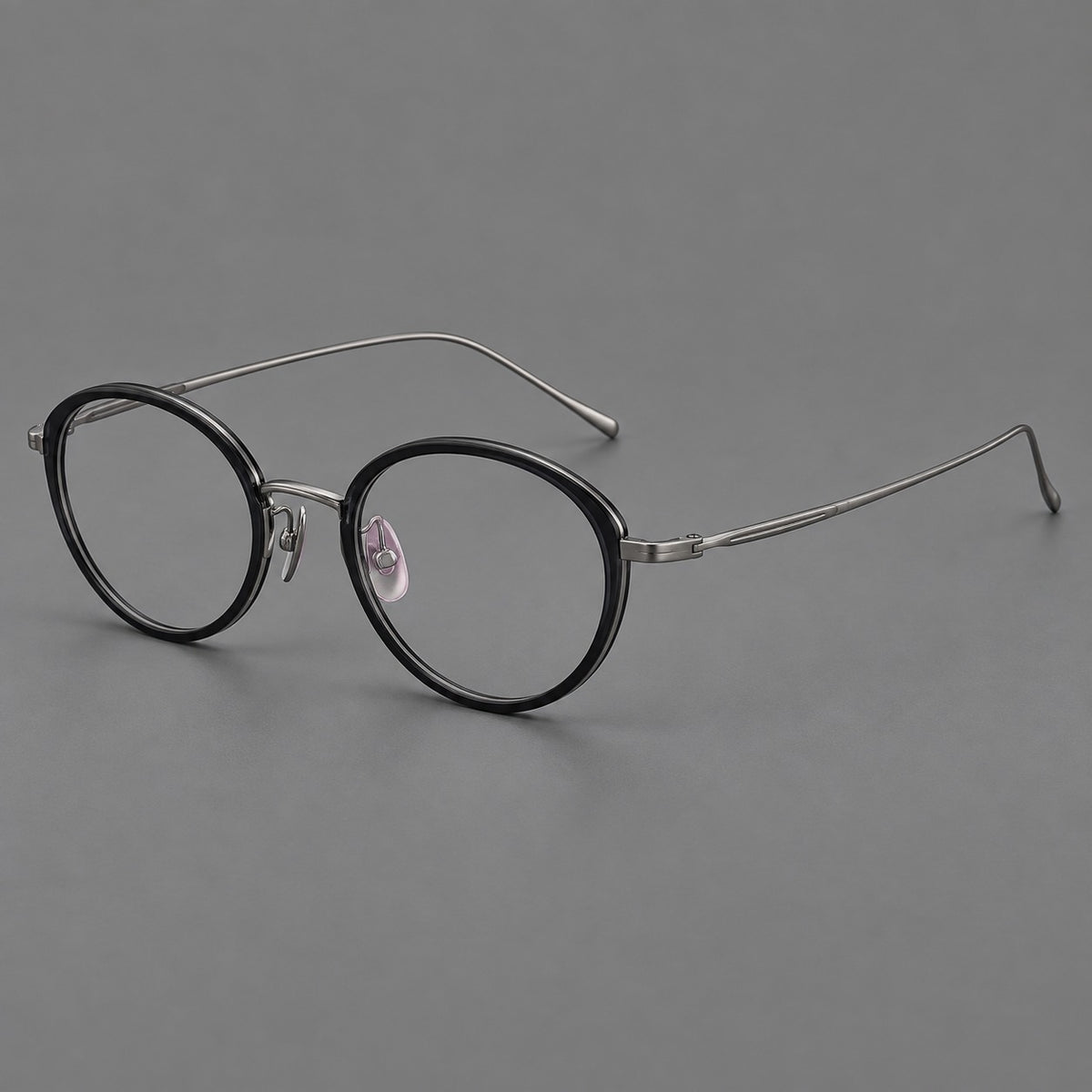 Round eyeglasses in acetate and titanium with a slim curved bridge and fine metal temples — Glossy Black / Gunmetal — Main view [CINILY-JD2026-61004-C6]