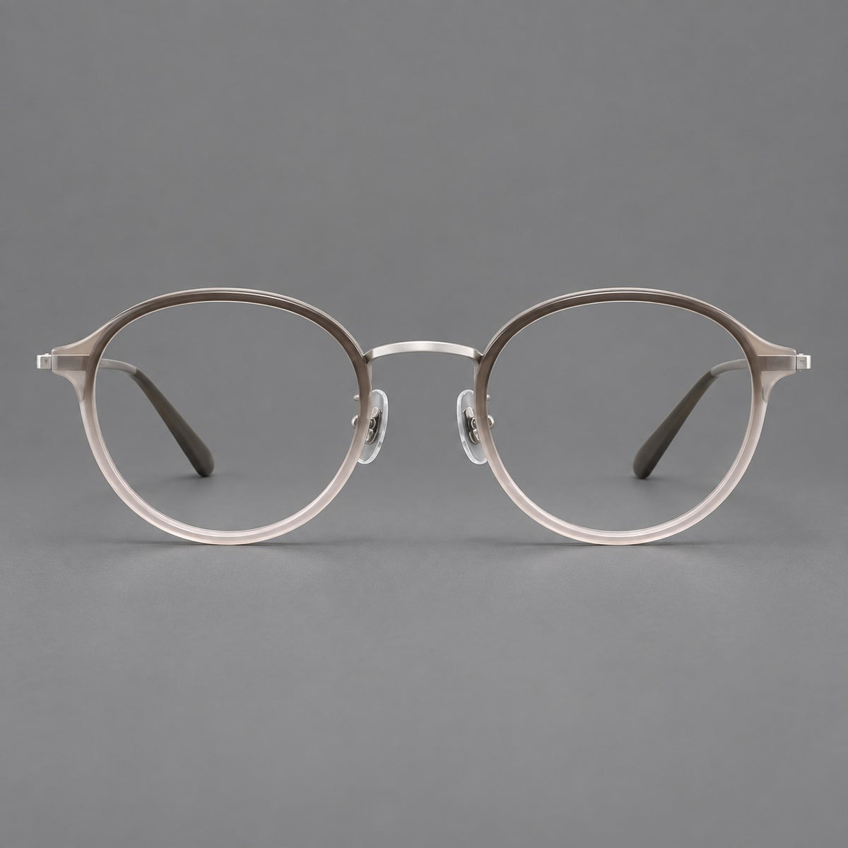 Softly rounded eyeglasses in acetate and titanium with a curved bridge and engraved temples — Tea Pink Gradient / Silver — Front view [CINILY-JD2026-61007-C3]