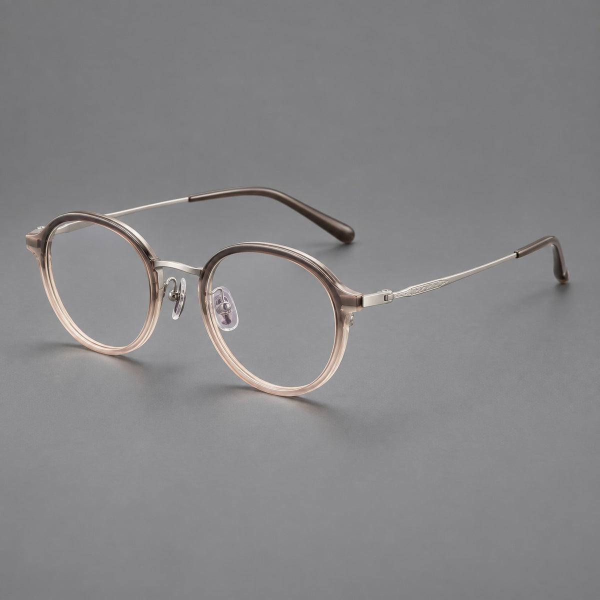Softly rounded eyeglasses in acetate and titanium with a curved bridge and engraved temples — Tea Pink Gradient / Silver — Main view [CINILY-JD2026-61007-C3]
