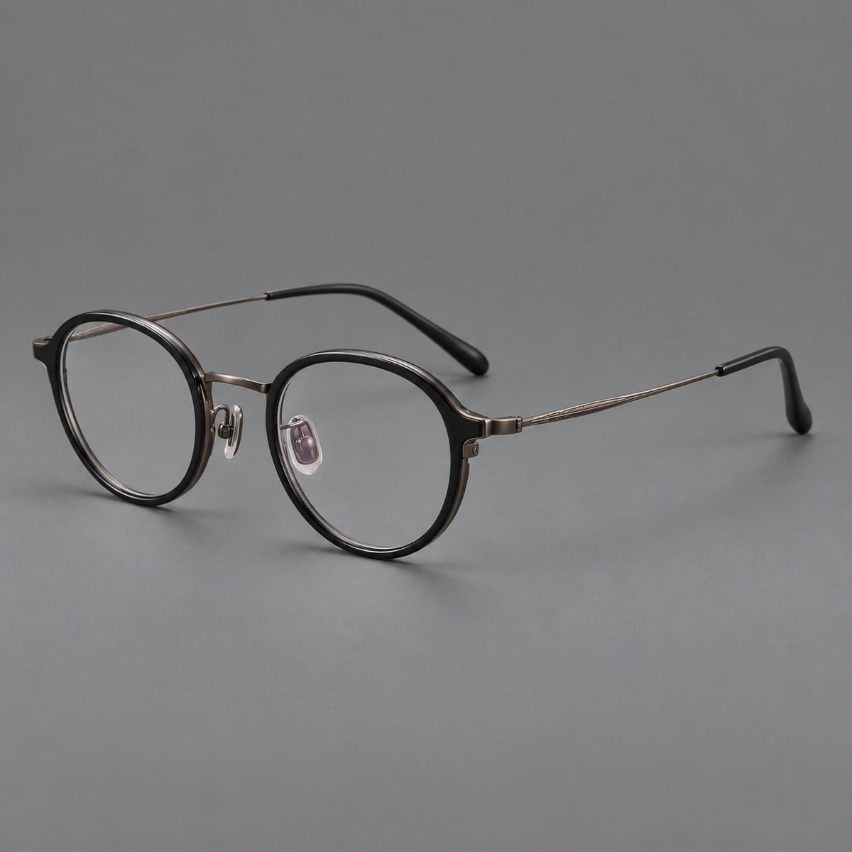 Softly rounded eyeglasses in acetate and titanium with a curved bridge and engraved temples — Matte Black / Antique Copper — Main view [CINILY-JD2026-61007-C5]