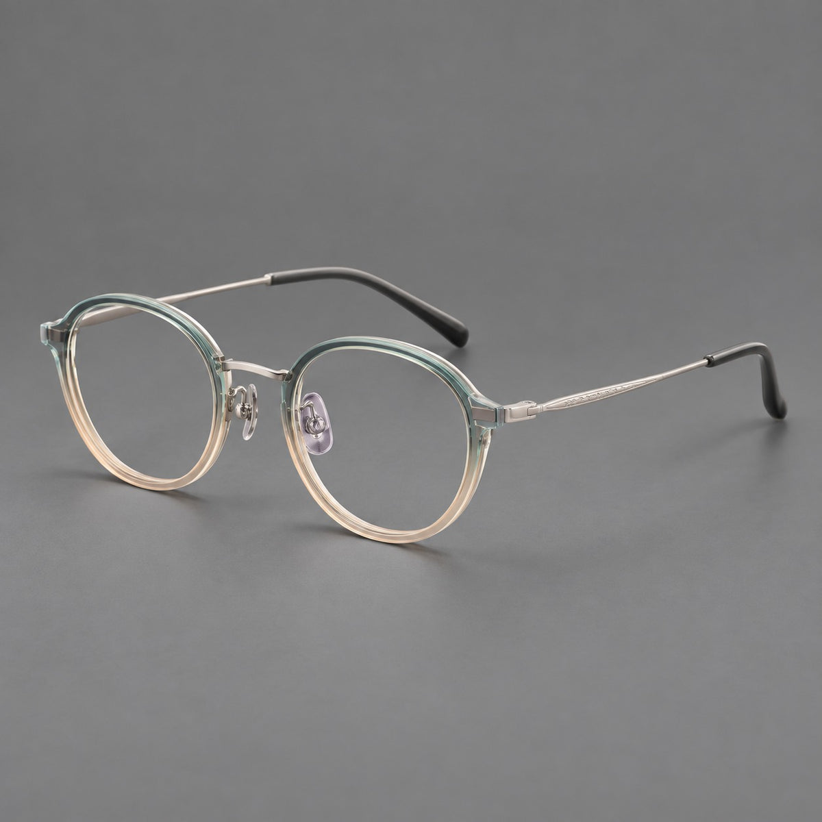 Softly rounded eyeglasses in acetate and titanium with a curved bridge and engraved temples — Green Tea Gradient / Silver — Main view [CINILY-JD2026-61007-C6]