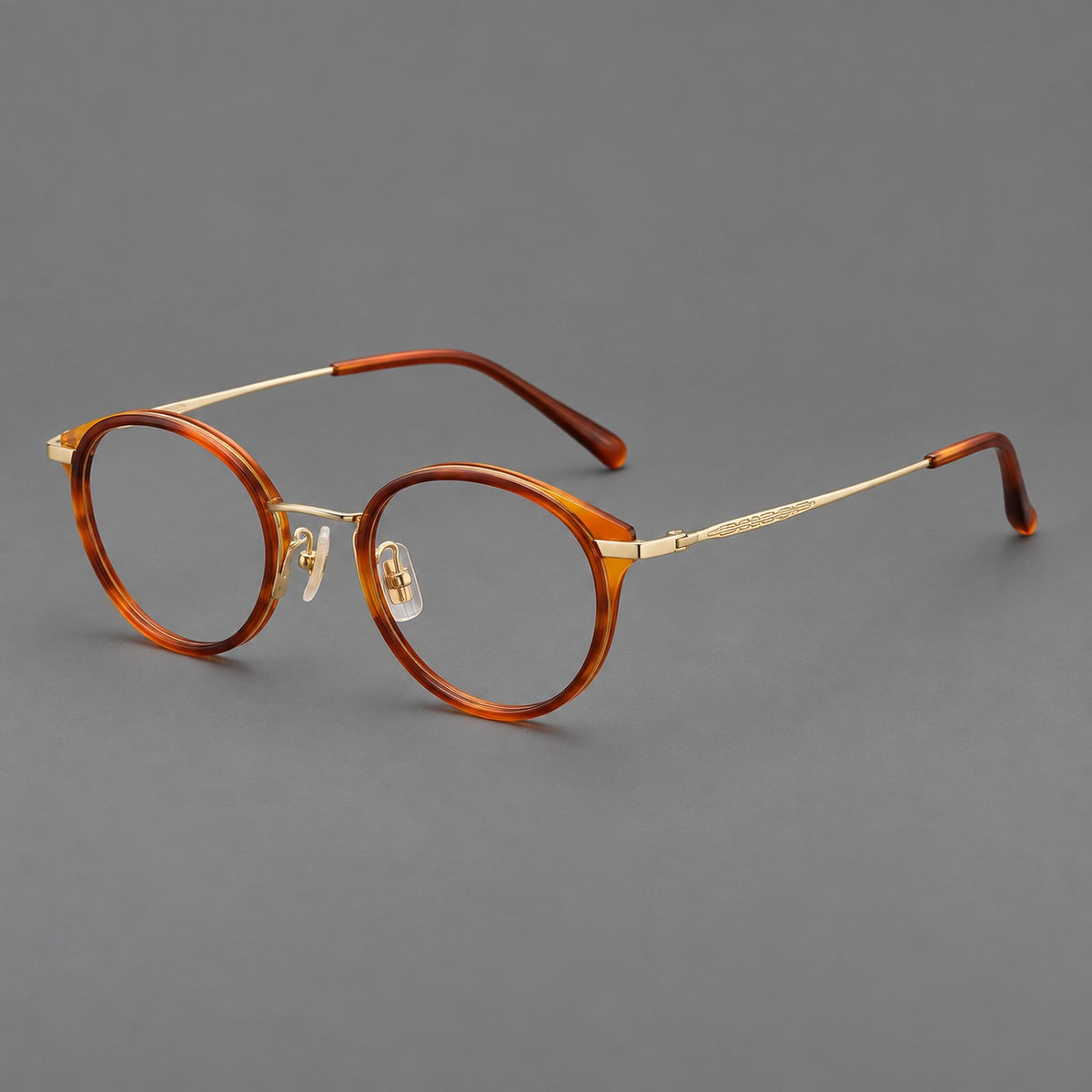 Retro panto eyeglasses in acetate and titanium with an arched bridge and engraved metal temples — Amber Tortoiseshell / Light Gold — Main view [CINILY-JD2026-61009-C1]