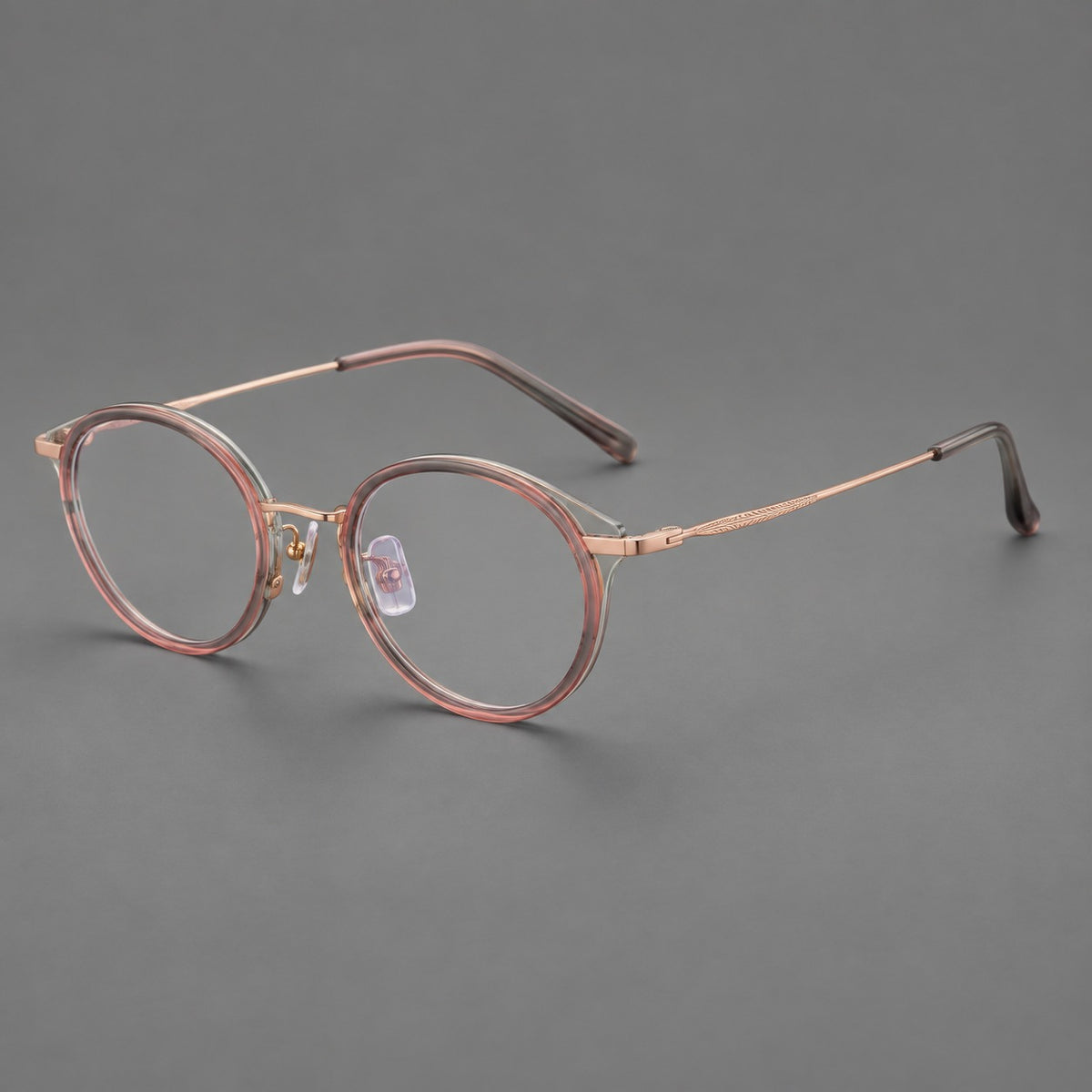 Retro panto eyeglasses in acetate and titanium with an arched bridge and engraved metal temples — Patterned Pink / Rose Gold — Main view [CINILY-JD2026-61009-C2]