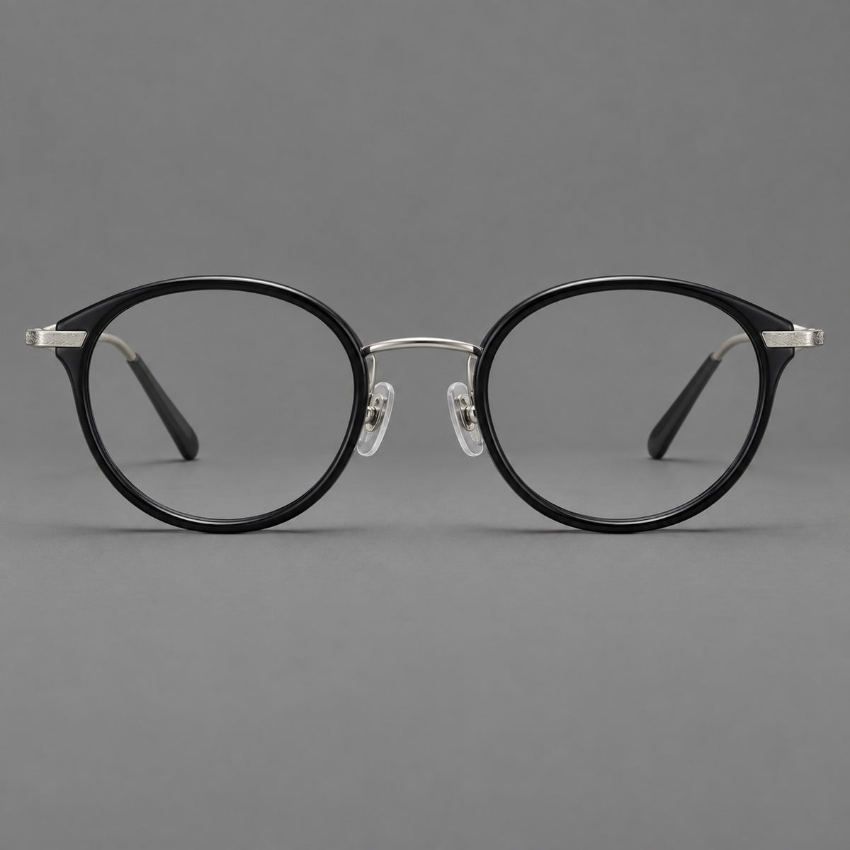 Retro panto eyeglasses in acetate and titanium with an arched bridge and engraved metal temples — Glossy Black / Matte Gunmetal — Front view [CINILY-JD2026-61009-C6]