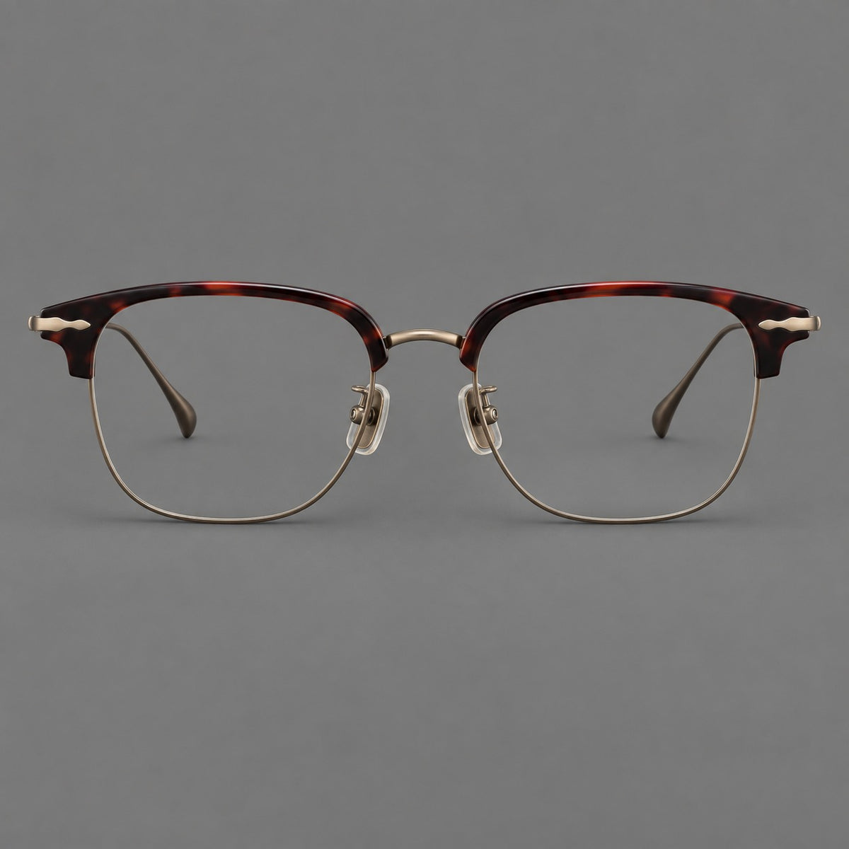 Browline eyeglasses in acetate and titanium with slim metal lower rims and decorative corners — Red Tortoiseshell / Antique Bronze — Front view [CINILY-JD2026-61012-C3]