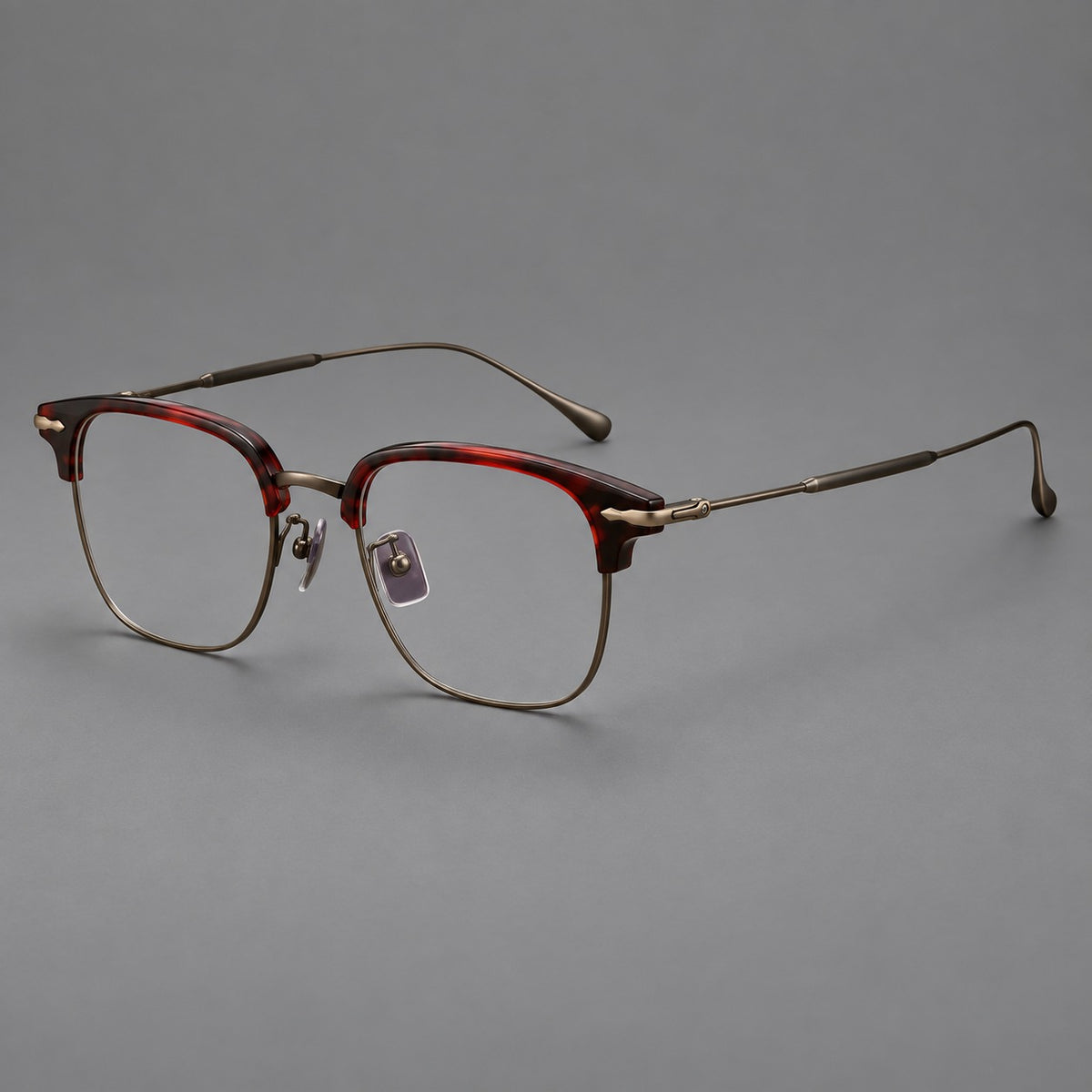Browline eyeglasses in acetate and titanium with slim metal lower rims and decorative corners — Red Tortoiseshell / Antique Bronze — Main view [CINILY-JD2026-61012-C3]