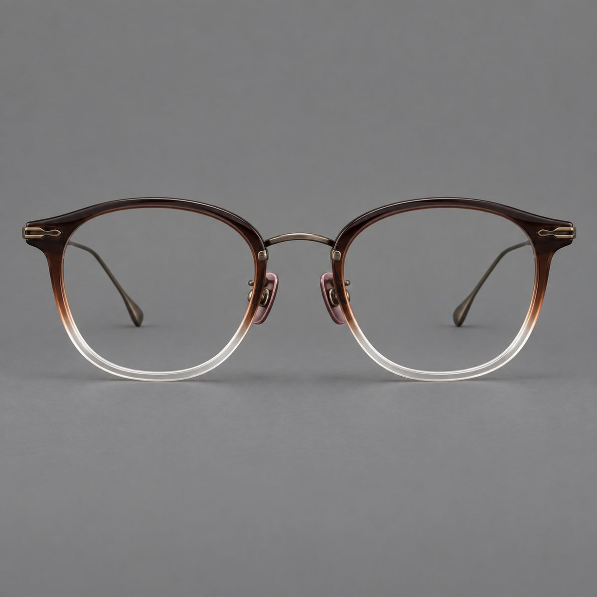 Panto eyeglasses in acetate and titanium with curved brows and decorative metal corner accents — Tea Brown Gradient / Antique Bronze — Front view [CINILY-JD2026-61014-C3]