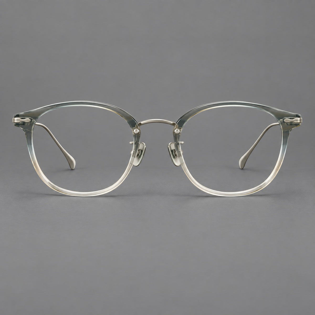 Panto eyeglasses in acetate and titanium with curved brows and decorative metal corner accents — Ice Blue Tea / Silver — Front view [CINILY-JD2026-61014-C5]