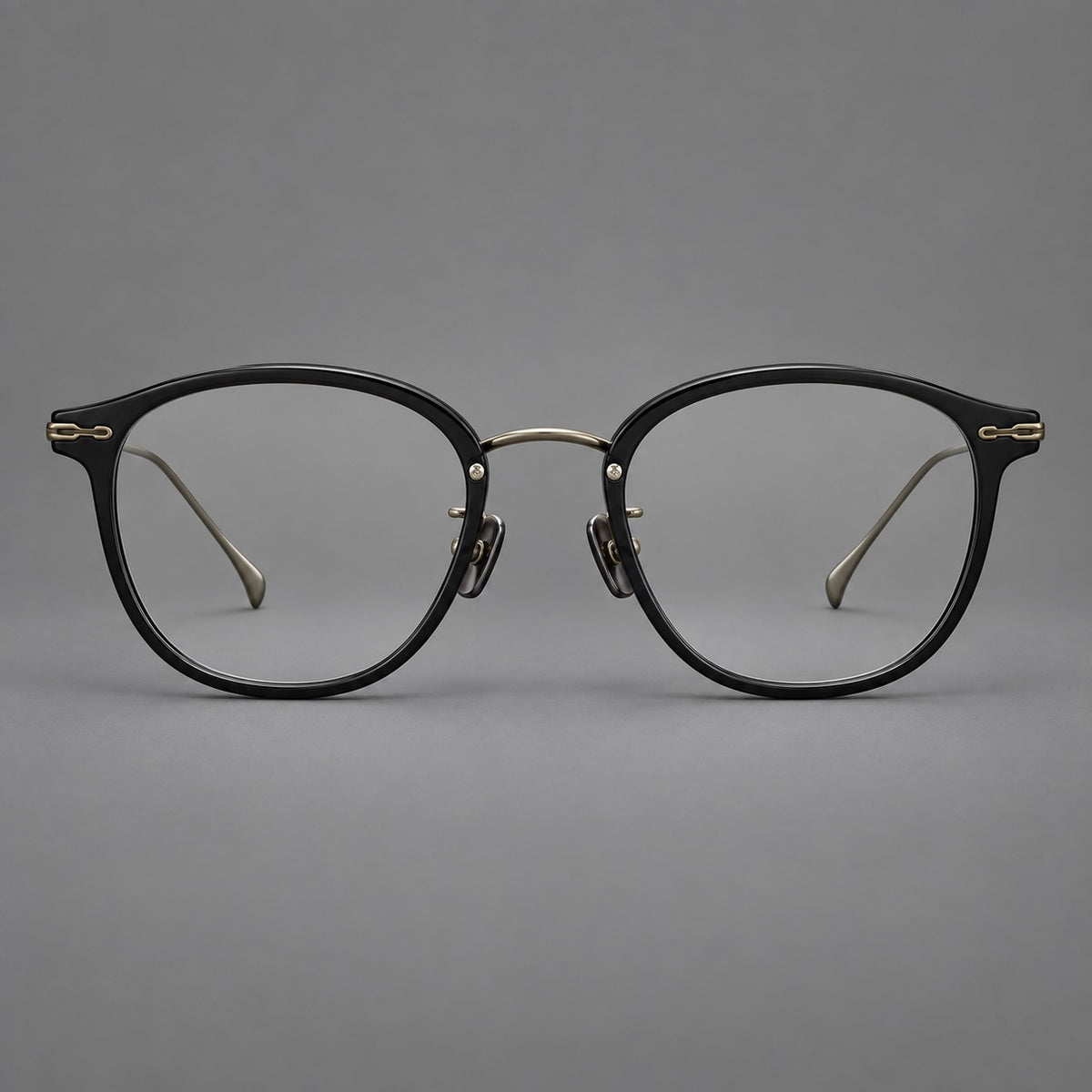 Panto eyeglasses in acetate and titanium with curved brows and decorative metal corner accents — Glossy Black / Antique Bronze — Front view [CINILY-JD2026-61014-C6]