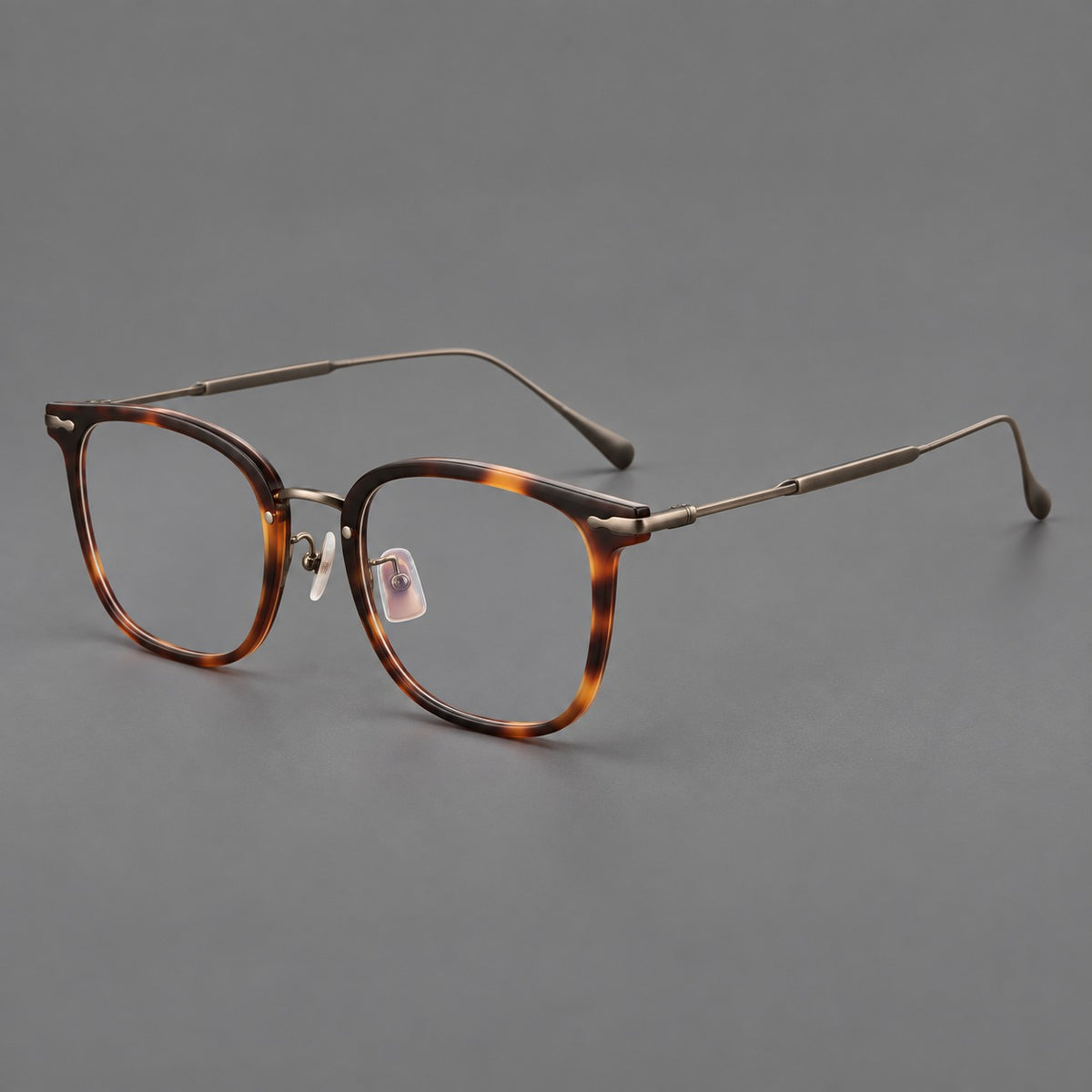Retro square eyeglasses in acetate and titanium with rounded edges and sculpted corner accents — Tortoiseshell / Antique Copper — Main view [CINILY-JD2026-61015-C1]