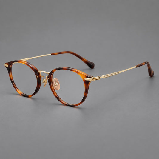Vintage panto eyeglasses in acetate and titanium with raised brows and textured metal temples — Tortoiseshell / Gold — Main view [CINILY-JD2026-61017-C1]