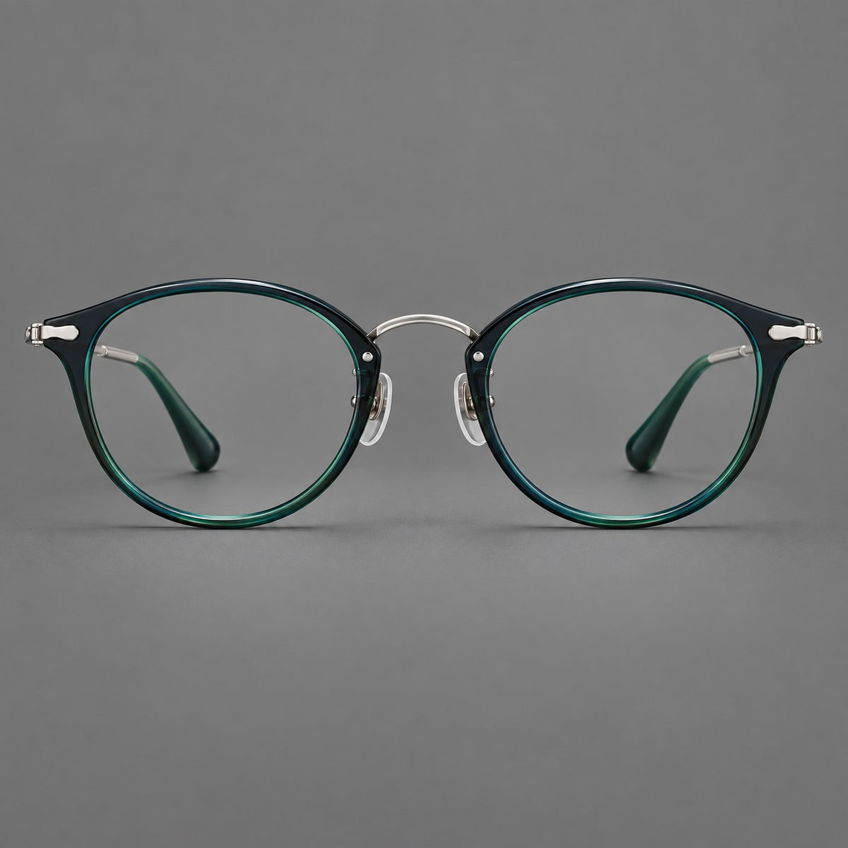 Vintage panto eyeglasses in acetate and titanium with raised brows and textured metal temples — Peacock Blue / Silver — Front view [CINILY-JD2026-61017-C2]