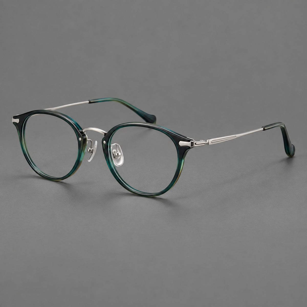 Vintage panto eyeglasses in acetate and titanium with raised brows and textured metal temples — Peacock Blue / Silver — Main view [CINILY-JD2026-61017-C2]