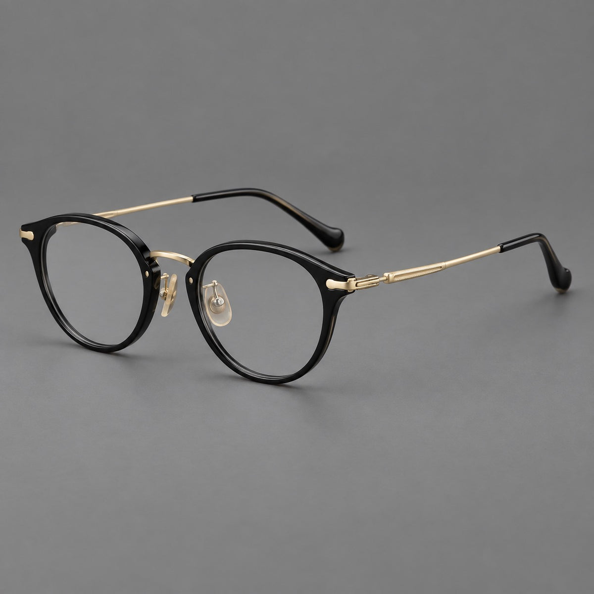 Vintage panto eyeglasses in acetate and titanium with raised brows and textured metal temples — Glossy Black / Gold — Main view [CINILY-JD2026-61017-C3]