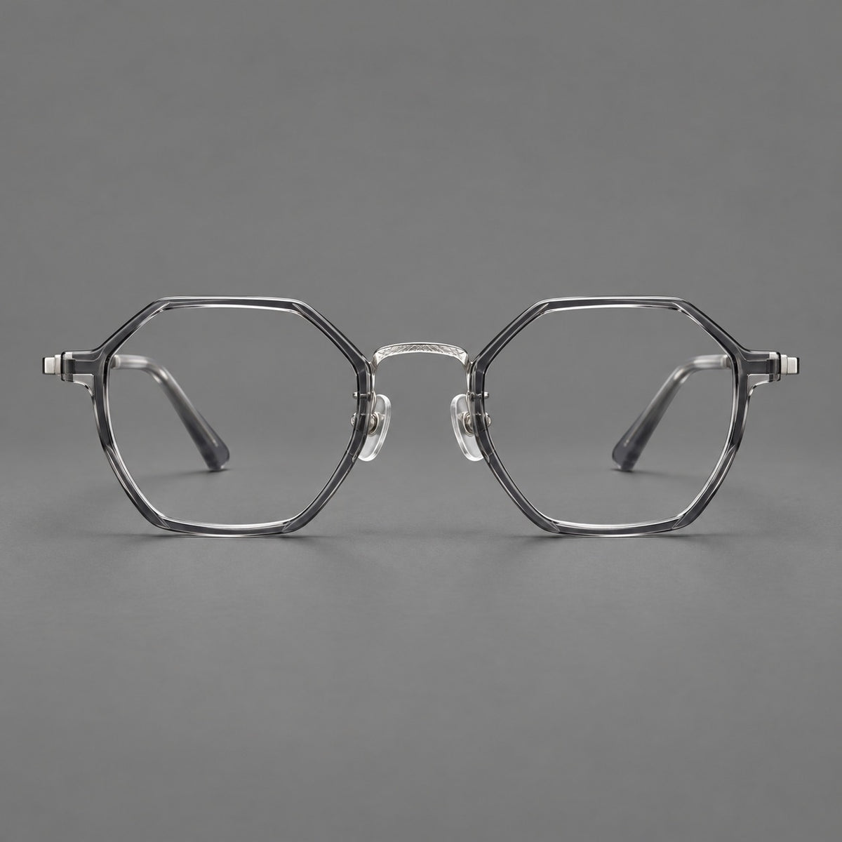 Geometric eyeglasses in acetate and titanium with octagonal rims and a textured metal bridge — Clear Mist Grey / Silver — Front view [CINILY-JD2026-61027-C2]