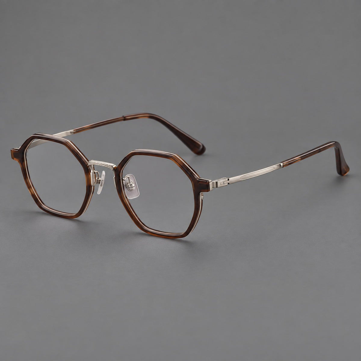 Geometric eyeglasses in acetate and titanium with octagonal rims and a textured metal bridge — Warm Tea Brown / Light Gunmetal — Main view [CINILY-JD2026-61027-C6]