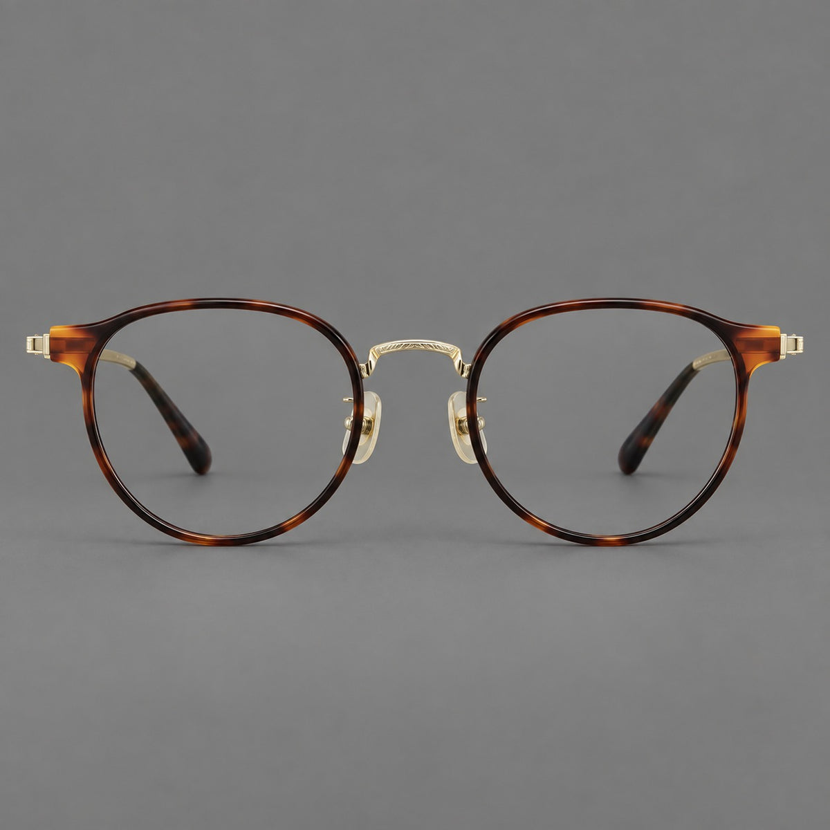 Round eyeglasses in acetate and titanium with widened outer corners and slender metal temples — Tortoiseshell / Gold — Front view [CINILY-JD2026-61028-C1]